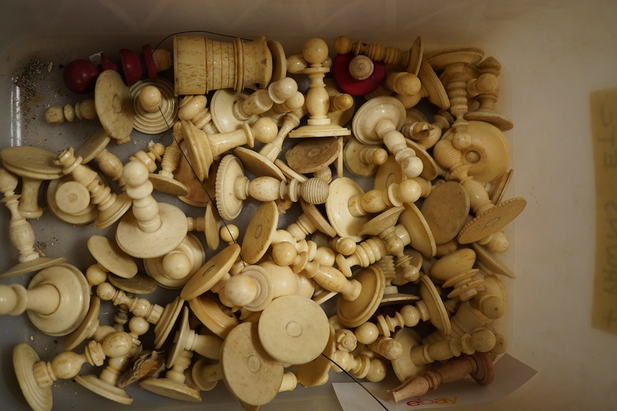 A collection of assorted stained bone chess pieces